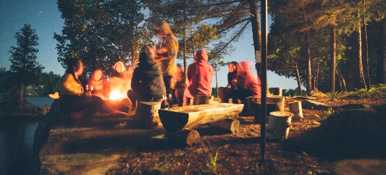 A group of people around a campfire