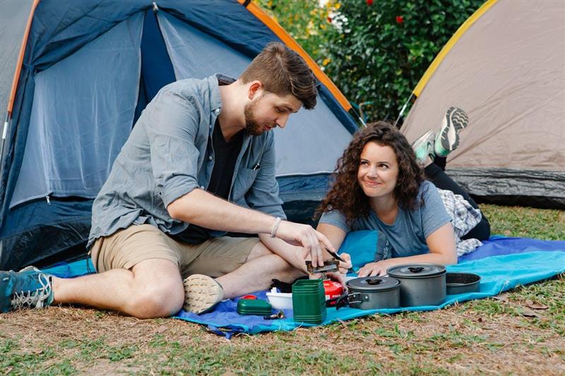 Couple camping, tents, camping food, containers