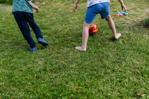 two children playing with a ball